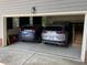 Spacious attached garage with room for two cars and extra storage space on coated concrete at 2325 Old Oak Pl, Hillsborough, NC 27278
