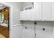 Laundry room featuring white cabinets and beadboard with laundry connections at 2325 Old Oak Pl, Hillsborough, NC 27278
