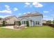 Well-manicured backyard featuring a patio, basketball hoop, lush lawn, and mature trees at 2333 Lantern Walk Ln, Wake Forest, NC 27587