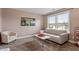 Bedroom providing a comfy lounge area and neutral carpeting at 2333 Lantern Walk Ln, Wake Forest, NC 27587