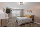 Bedroom displaying neutral walls and carpeting with a large window at 2333 Lantern Walk Ln, Wake Forest, NC 27587