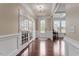 Elegant foyer features hardwood floors, crown molding and a view to the entry door and office area at 2333 Lantern Walk Ln, Wake Forest, NC 27587