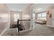 Bright hallway with access to the lower level, featuring a cozy lounge area at 2333 Lantern Walk Ln, Wake Forest, NC 27587
