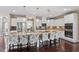 Gourmet kitchen with granite counters, stainless appliances, tile backsplash, pendant lighting and a large island at 2333 Lantern Walk Ln, Wake Forest, NC 27587