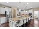 Spacious kitchen features granite countertops, stainless steel appliances, a large island with seating, and ample cabinet space at 2333 Lantern Walk Ln, Wake Forest, NC 27587