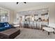 Open-concept living room featuring a modern kitchen and comfortable seating area at 2333 Lantern Walk Ln, Wake Forest, NC 27587