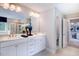 Bright and airy bathroom with double sinks, white cabinets, and modern fixtures at 2512 Stonington Dr, Cary, NC 27523