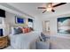 Bright bedroom with neutral decor, a ceiling fan, and an adjoining doorway at 2512 Stonington Dr, Cary, NC 27523