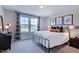 Cozy bedroom featuring a full bed, large window, and sporty decor at 2512 Stonington Dr, Cary, NC 27523