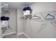 Walk-in closet with ventilated shelving, perfect for organizing clothes and accessories at 2512 Stonington Dr, Cary, NC 27523