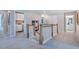 Upstairs hallway featuring wood railing, neutral carpet, and easy access to rooms at 2512 Stonington Dr, Cary, NC 27523