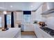 Stylish kitchen with stainless appliances, stone countertops, and natural lighting at 2512 Stonington Dr, Cary, NC 27523