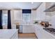 Stylish kitchen with stainless appliances, stone countertops, and natural lighting at 2512 Stonington Dr, Cary, NC 27523