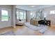 Bright living room with hardwood floors, natural light, neutral paint, and stylish furniture at 2512 Stonington Dr, Cary, NC 27523
