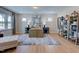 Bright living room with hardwood floors, natural light, neutral paint, and stylish furniture at 2512 Stonington Dr, Cary, NC 27523