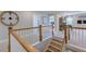Inviting staircase leading to a game room, showcasing natural wood railings and ample space at 2512 Stonington Dr, Cary, NC 27523