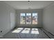 Sunny bedroom with triple windows and a neutral palette, ready for personalization at 252 Meadowbark Bnd # 46, Garner, NC 27529