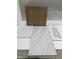 Sample of brown cabinet with a countertop and white and marble-look tile samples at 252 Meadowbark Bnd # 46, Garner, NC 27529