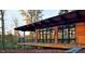 Modern house with wood siding and large windows overlooking a wooded area at 252 Meadowbark Bnd # 46, Garner, NC 27529