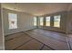 Spacious living room with three windows, awaiting customization at 252 Meadowbark Bnd # 46, Garner, NC 27529