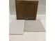Interior design sample showcasing a dark stained cabinet door, white counter, and light gray flooring at 263 Meadowbark Bnd # 33, Garner, NC 27529