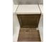 Interior design sample showcasing a dark cabinet door, white counter, and light brown flooring at 263 Meadowbark Bnd # 33, Garner, NC 27529