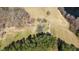 Aerial view of the property, showcasing the home, surrounding land, and neighboring fields at 2710 Morton Pulliam Rd, Roxboro, NC 27574