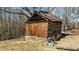 Rustic log cabin style outbuilding with stone foundation at 2778 Morton-Pulliam Rd, Roxboro, NC 27574
