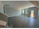 Open living room with wood floors, natural light, and neutral walls, ready for personal touches at 285 Gregory Village Dr, Lillington, NC 27546