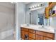 Bathroom with a double sink vanity, large mirror and shower tub combo at 308 Deep Creek Dr, Clayton, NC 27520