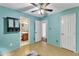 Bedroom showcasing an ensuite bathroom and walk-in closet, plus a ceiling fan and neutral flooring at 308 Deep Creek Dr, Clayton, NC 27520