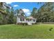 View of a well maintained single Gathering home, with a white picket fence and beautiful green lawn at 308 Deep Creek Dr, Clayton, NC 27520
