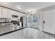 Spacious kitchen with stainless steel appliances, bright windows and decorative tiled floors at 308 Deep Creek Dr, Clayton, NC 27520