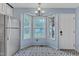 Light-filled kitchen with stainless steel refrigerator, bay window and unique tile floor at 308 Deep Creek Dr, Clayton, NC 27520