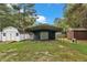 Features a metal carport, wooden sheds, and a spacious yard, ideal for storage and outdoor activities at 308 Deep Creek Dr, Clayton, NC 27520
