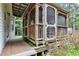 Screened-in porch attached to the house offers an outdoor living space with a view of the greenery at 308 Deep Creek Dr, Clayton, NC 27520