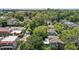 Aerial view showcases neighborhood homes nestled among mature trees with city views at 311 N Gregson St, Durham, NC 27701