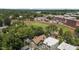 High-angle aerial displaying the property near a school with a track and sports field at 311 N Gregson St, Durham, NC 27701