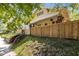 Charming two-story yellow home with a new fence and landscaped front yard at 311 N Gregson St, Durham, NC 27701