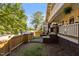 View of front yard with a wooden fence and brick stairway leading to the front door at 311 N Gregson St, Durham, NC 27701