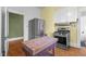 Spacious kitchen featuring stainless steel appliances, butcher block island, and hardwood floors at 311 N Gregson St, Durham, NC 27701