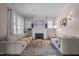 Cozy living room features hardwood floors, a decorative fireplace, and comfortable seating at 311 N Gregson St, Durham, NC 27701