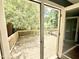 A wooden back deck with a railing overlooking a wooded yard provides outdoor living and entertaining at 322 S Dixon Ave, Cary, NC 27511