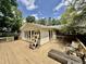 Large deck offers space for outdoor living and entertaining with convenient access to the backyard at 322 S Dixon Ave, Cary, NC 27511