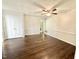 Bedroom featuring hardwood floors, a ceiling fan, and closet at 322 S Dixon Ave, Cary, NC 27511