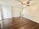Bedroom featuring hardwood floors, a ceiling fan, and closet at 322 S Dixon Ave, Cary, NC 27511