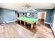 The game room features a pool table, hardwood floors, and neutral wall colors at 322 S Dixon Ave, Cary, NC 27511