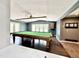 Spacious game room with a pool table, hardwood floors, and access to the deck at 322 S Dixon Ave, Cary, NC 27511