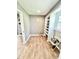 A laundry room is equipped with built-in shelving and tile floors for efficient organization at 322 S Dixon Ave, Cary, NC 27511