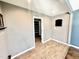 A spacious living room features tile floors, neutral paint, recessed lighting and a closet at 322 S Dixon Ave, Cary, NC 27511